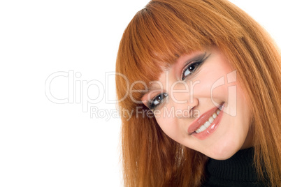 Portrait of the attractive smiling redheaded woman