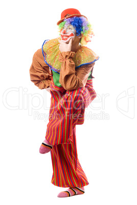 Funny clown standing on one leg