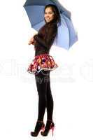 Playful young woman with umbrella