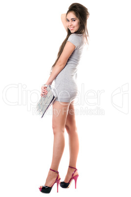 Happy brunette in gray dress