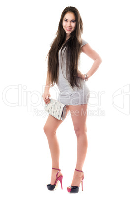 Smiling pretty brunette in gray dress