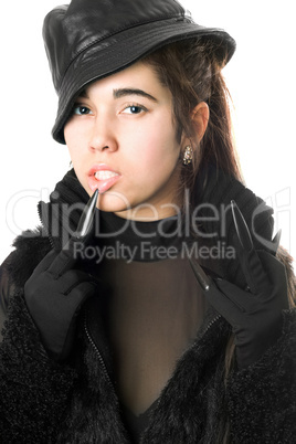 Portrait of pretty young brunette in gloves with claws