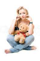 Pretty young blonde with a teddy bear