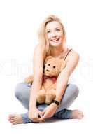 Cheerful blonde with a teddy bear
