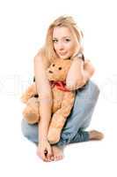 Smiling blonde with a teddy bear
