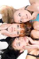 Three disturbed women touching their cheeks