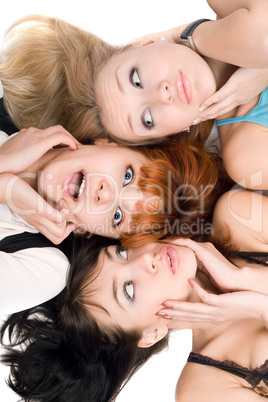 Three amazed women touching their cheeks