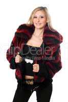 Young sexy blond woman in a fur jacket