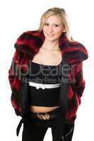 Smiling young blond woman in a fur jacket