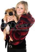 Blond woman holding a pekinese puppy