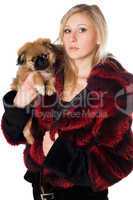 Attractive woman holding a pekinese