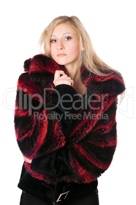 Young blond woman in a fur jacket