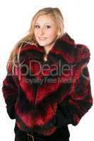 Portrait of joyful blond woman in fur jacket