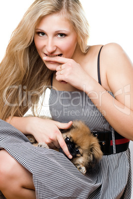 Portrait of young woman with puppy