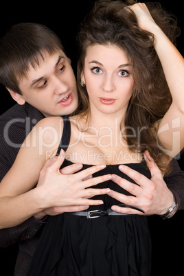 Handsome man holding woman