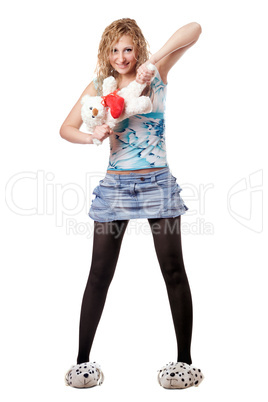 Young blond woman with teddy bear toy