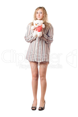 Playful woman holding teddy bear