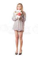 Playful woman holding teddy bear