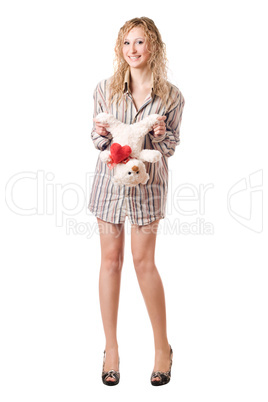 Smiling blonde holding teddy bear