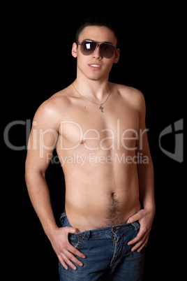 Portrait of smiling handsome young man in sunglasses. Isolated