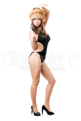 brunette posing in swimsuit and fur-cap