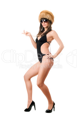 Sexy lady in sunglasses wearing swimsuit and fur-cap