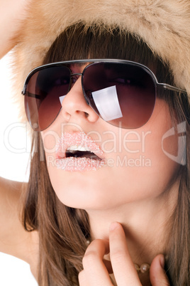 sexy woman wearing sunglasses with sugar lips
