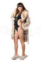 Playful woman wearing leopard coat and house slippers