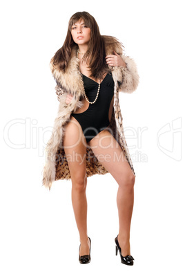 Sexy brunette wearing swimsuit and leopard coat