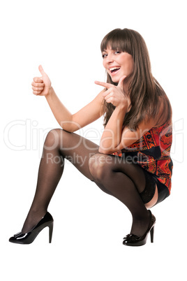 Cheerful woman showing thumb