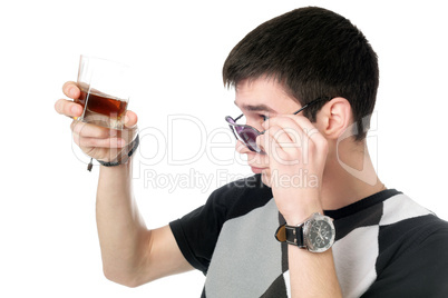 Young man with a glass