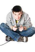 Young man with a joystick for game console