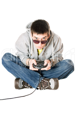 Young man in sunglasses with a joystick