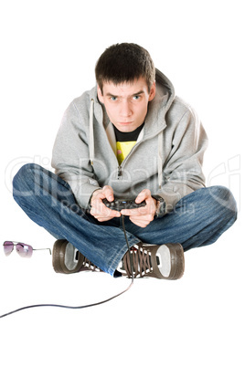 Young man with a joystick for game console. Isolated