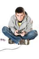 Young man with a joystick for game console. Isolated