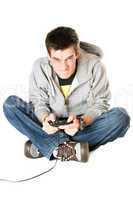 Furious young man with a joystick for game console