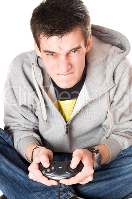 Portrait of furious young man with a joystick
