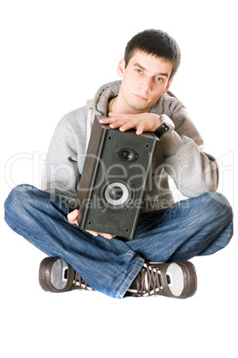 Young man with a speaker in his hands