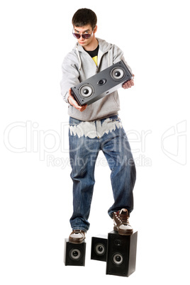 Young man with a four speakers. Isolated