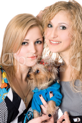 two smiling young women with dog