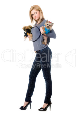 Pretty young blonde posing with two dogs