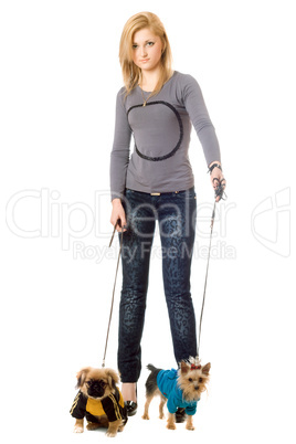 Beautiful young blonde posing with two dogs