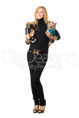 Smiling pretty young blonde posing with two dogs