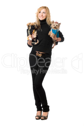 Cheerful young blonde posing with two dogs
