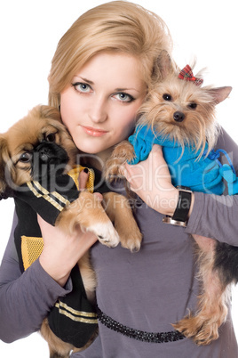 Portrait of attractive blonde with two dogs. Isolated