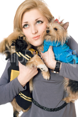 Portrait of attractive young blonde with two dogs. Isolated