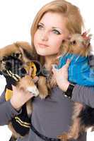 Portrait of pretty young blonde with two dogs. Isolated
