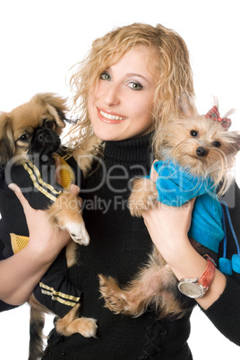 Portrait of smiling attractive blonde with two dogs. Isolated