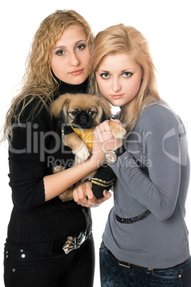 two pretty young women with pekingese