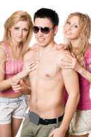 Two happy blonde women with young man